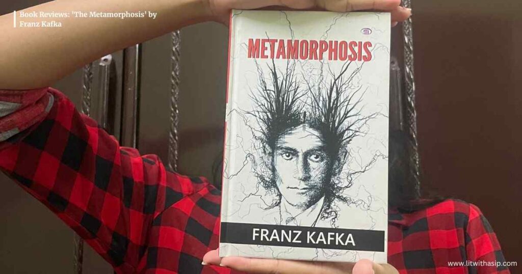 Book Review of the Metamorphosis by Franz Kafka with a girl holding the book before her face flaunting the cover. 